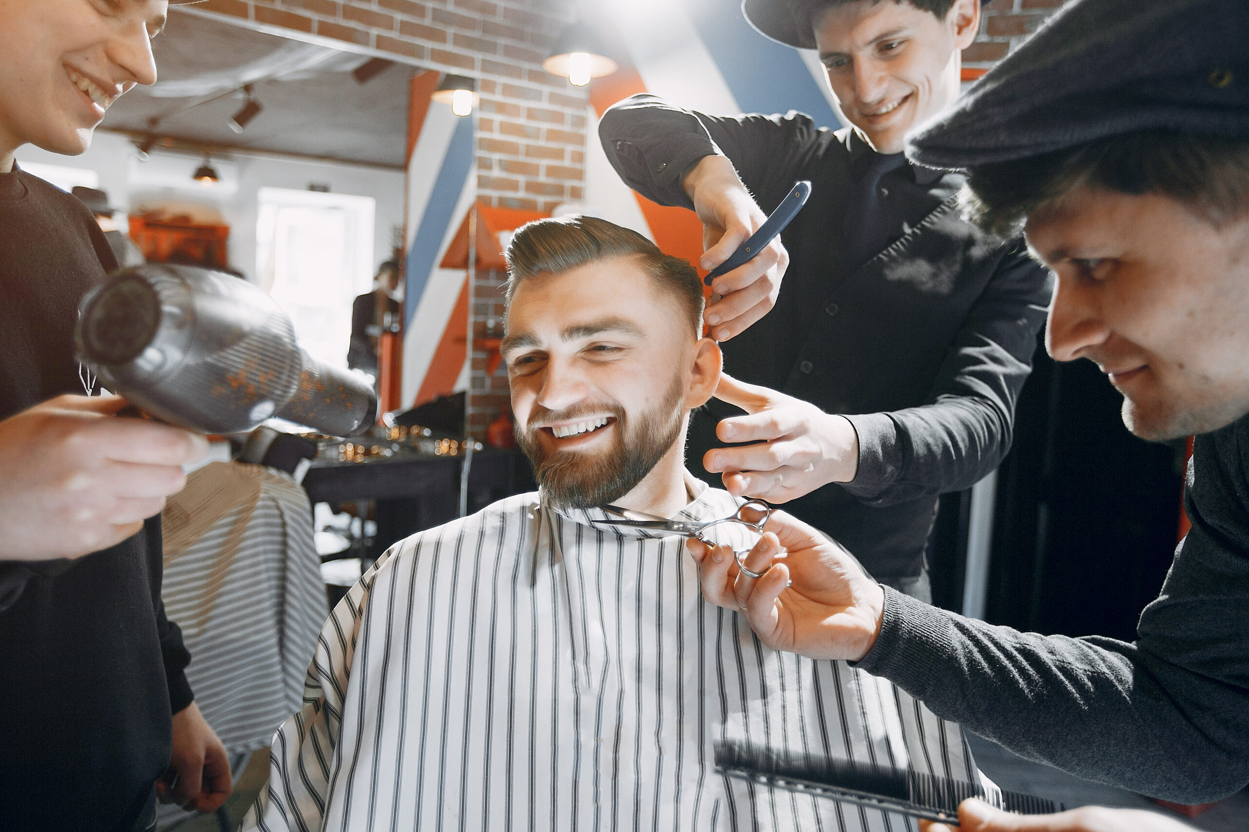 Man with a beard. Hairdresser with a client.